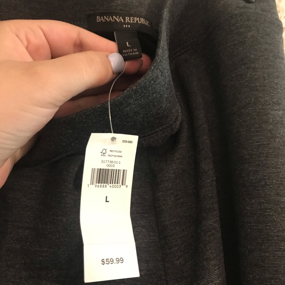 Grey dress pants with side zipper. Never worn.